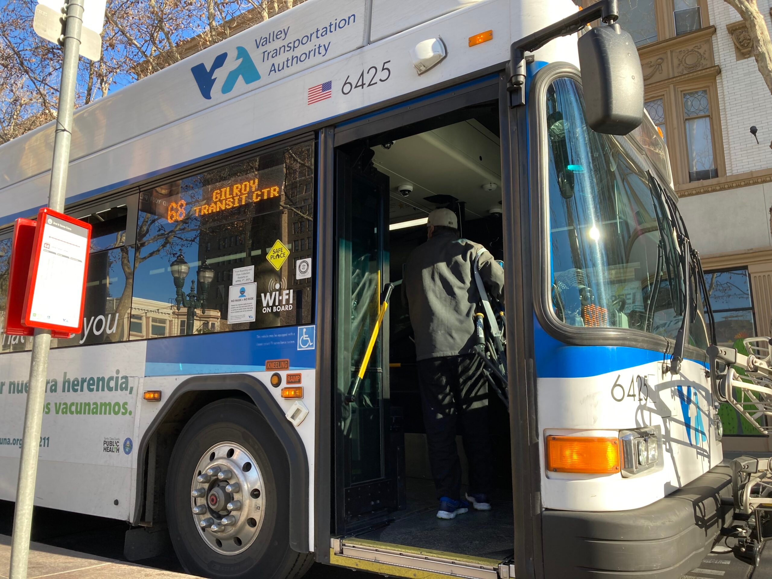 Parked VTA bus with entering rider
